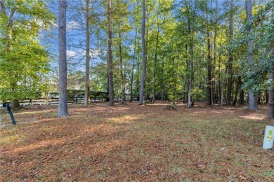 Design your dream home on this spacious corner wooded lot in the on Berkeley Hall Golf Club in South Carolina - for sale on GolfHomes.com, golf home, golf lot