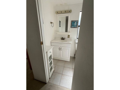 Charming 2-bedroom home in highly sought after Hidden Golf on Lake Henry Golf Club in Florida - for sale on GolfHomes.com, golf home, golf lot