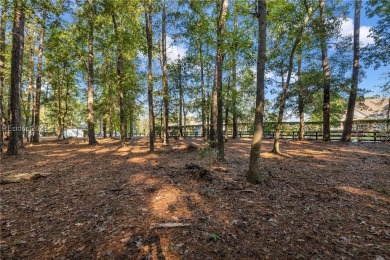 Design your dream home on this spacious corner wooded lot in the on Berkeley Hall Golf Club in South Carolina - for sale on GolfHomes.com, golf home, golf lot