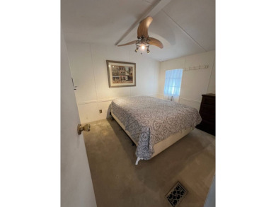 Charming 2-bedroom home in highly sought after Hidden Golf on Lake Henry Golf Club in Florida - for sale on GolfHomes.com, golf home, golf lot