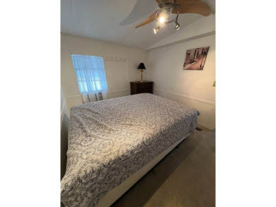 Charming 2-bedroom home in highly sought after Hidden Golf on Lake Henry Golf Club in Florida - for sale on GolfHomes.com, golf home, golf lot