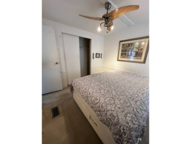 Charming 2-bedroom home in highly sought after Hidden Golf on Lake Henry Golf Club in Florida - for sale on GolfHomes.com, golf home, golf lot