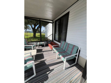 Charming 2-bedroom home in highly sought after Hidden Golf on Lake Henry Golf Club in Florida - for sale on GolfHomes.com, golf home, golf lot