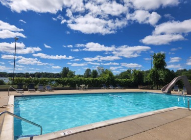 Incredible and updated Trapper Woods condo, nestled in the on Canadian Lakes Country Club-The Pines Course in Michigan - for sale on GolfHomes.com, golf home, golf lot