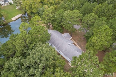 Lakefront living in Terre Du Lac! This brick and stone accented on Terre Du Lac Golf and Country Club in Missouri - for sale on GolfHomes.com, golf home, golf lot