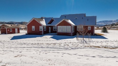 Nestled on over 2 acres of picturesque land, this custom-built on Rifle Creek Golf Course in Colorado - for sale on GolfHomes.com, golf home, golf lot