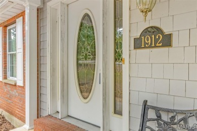 Lakefront living in Terre Du Lac! This brick and stone accented on Terre Du Lac Golf and Country Club in Missouri - for sale on GolfHomes.com, golf home, golf lot