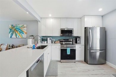 ALL AGES & ANIMAL FRIENDLY! This amazing, one of a kind on Isla Del Sol Yacht and Country Club in Florida - for sale on GolfHomes.com, golf home, golf lot