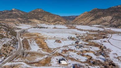 Nestled on over 2 acres of picturesque land, this custom-built on Rifle Creek Golf Course in Colorado - for sale on GolfHomes.com, golf home, golf lot