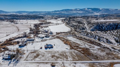 Nestled on over 2 acres of picturesque land, this custom-built on Rifle Creek Golf Course in Colorado - for sale on GolfHomes.com, golf home, golf lot