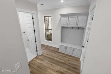 Step inside this beautifully designed new construction lakefront on Lake Caroline Golf Club in Mississippi - for sale on GolfHomes.com, golf home, golf lot