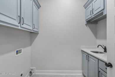 Step inside this beautifully designed new construction lakefront on Lake Caroline Golf Club in Mississippi - for sale on GolfHomes.com, golf home, golf lot