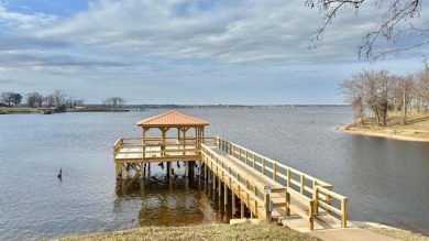 Nestled on a peaceful lot that backs to a well-stocked fishing on Links At Lands End in Texas - for sale on GolfHomes.com, golf home, golf lot