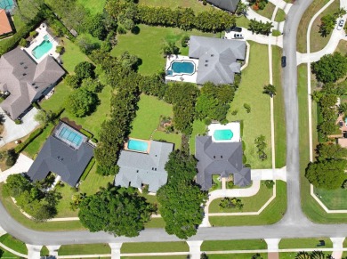 This single family pool home is nestled on a lush and tropical on The Wanderers Club in Florida - for sale on GolfHomes.com, golf home, golf lot