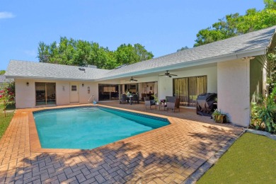 This single family pool home is nestled on a lush and tropical on The Wanderers Club in Florida - for sale on GolfHomes.com, golf home, golf lot