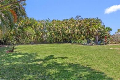 This single family pool home is nestled on a lush and tropical on The Wanderers Club in Florida - for sale on GolfHomes.com, golf home, golf lot
