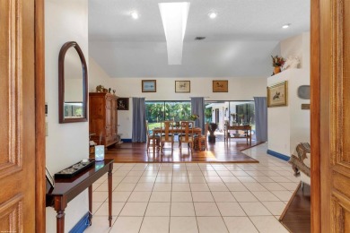 This single family pool home is nestled on a lush and tropical on The Wanderers Club in Florida - for sale on GolfHomes.com, golf home, golf lot