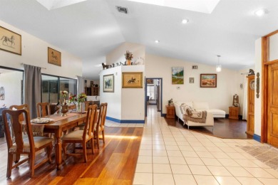 This single family pool home is nestled on a lush and tropical on The Wanderers Club in Florida - for sale on GolfHomes.com, golf home, golf lot