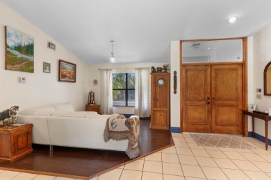 This single family pool home is nestled on a lush and tropical on The Wanderers Club in Florida - for sale on GolfHomes.com, golf home, golf lot