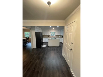 Discover a rare gem in the sought-after Pine Ridge Country Club on Collins Hill Golf Club in Georgia - for sale on GolfHomes.com, golf home, golf lot