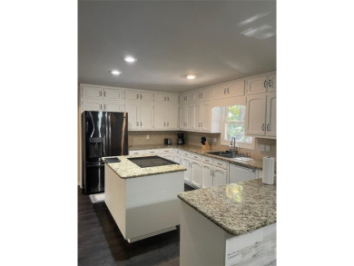Discover a rare gem in the sought-after Pine Ridge Country Club on Collins Hill Golf Club in Georgia - for sale on GolfHomes.com, golf home, golf lot
