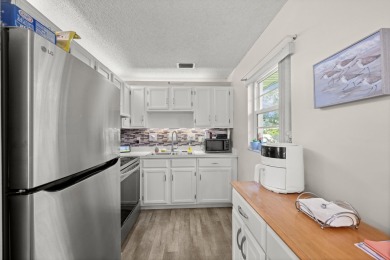 This well kept corner unit offers 1 bed, 1.5 bath- just steps on The American Golf Club in Florida - for sale on GolfHomes.com, golf home, golf lot