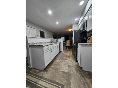 This charming 2-bedroom, 2.5-bath townhouse-style condominium on Marysville Golf Course in Michigan - for sale on GolfHomes.com, golf home, golf lot