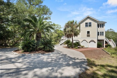 Gorgeous custom built home with enchanting marsh views. Walk to on Ocean Creek Golf Course in South Carolina - for sale on GolfHomes.com, golf home, golf lot