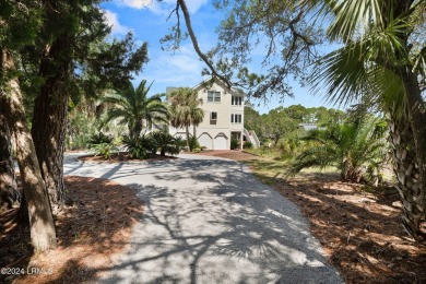 Gorgeous custom built home with enchanting marsh views. Walk to on Ocean Creek Golf Course in South Carolina - for sale on GolfHomes.com, golf home, golf lot