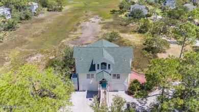 Gorgeous custom built home with enchanting marsh views. Walk to on Ocean Creek Golf Course in South Carolina - for sale on GolfHomes.com, golf home, golf lot