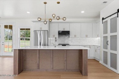 Welcome to 355 S Middleton Dr NW, a stunning new construction on Brunswick Plantation and Golf Resorts in North Carolina - for sale on GolfHomes.com, golf home, golf lot
