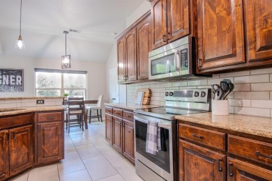 Welcome home to this charming 4-bedroom, 2-bathroom residence on Sugar Tree Golf and Country Club in Texas - for sale on GolfHomes.com, golf home, golf lot