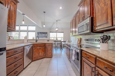 Welcome home to this charming 4-bedroom, 2-bathroom residence on Sugar Tree Golf and Country Club in Texas - for sale on GolfHomes.com, golf home, golf lot