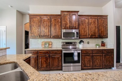 Welcome home to this charming 4-bedroom, 2-bathroom residence on Sugar Tree Golf and Country Club in Texas - for sale on GolfHomes.com, golf home, golf lot