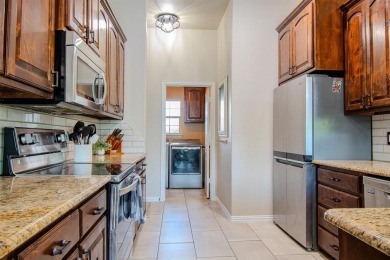 Welcome home to this charming 4-bedroom, 2-bathroom residence on Sugar Tree Golf and Country Club in Texas - for sale on GolfHomes.com, golf home, golf lot
