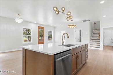 Welcome to 355 S Middleton Dr NW, a stunning new construction on Brunswick Plantation and Golf Resorts in North Carolina - for sale on GolfHomes.com, golf home, golf lot