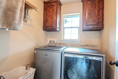Welcome home to this charming 4-bedroom, 2-bathroom residence on Sugar Tree Golf and Country Club in Texas - for sale on GolfHomes.com, golf home, golf lot