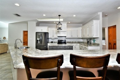Prepare to be captivated by this extraordinary Gulf Access on Twin Isles Country Club in Florida - for sale on GolfHomes.com, golf home, golf lot