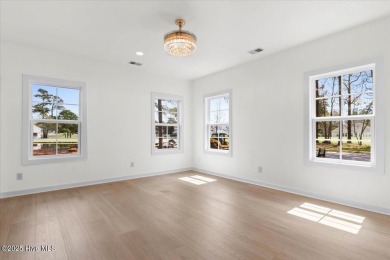 Welcome to 355 S Middleton Dr NW, a stunning new construction on Brunswick Plantation and Golf Resorts in North Carolina - for sale on GolfHomes.com, golf home, golf lot