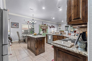 Welcome to this meticulously maintained, single-story on Pecan Plantation Country Club in Texas - for sale on GolfHomes.com, golf home, golf lot