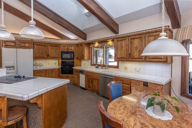 Spectacular views of the Bridger Mountain Range from this home on Riverside Country Club in Montana - for sale on GolfHomes.com, golf home, golf lot