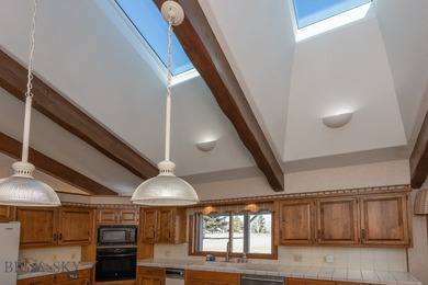 Spectacular views of the Bridger Mountain Range from this home on Riverside Country Club in Montana - for sale on GolfHomes.com, golf home, golf lot