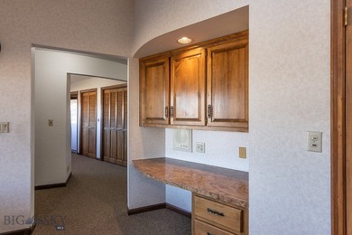 Spectacular views of the Bridger Mountain Range from this home on Riverside Country Club in Montana - for sale on GolfHomes.com, golf home, golf lot