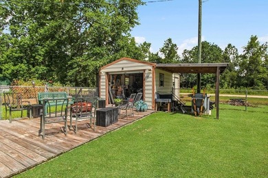 HOME, BOAT , GOLF CART AND MULTIPLE STORAGE BUILDINGS CAN BE ALL on Sapelo Hammock Golf Club in Georgia - for sale on GolfHomes.com, golf home, golf lot