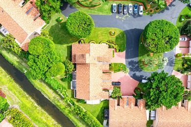 Entry is secured, visitors must provide the address 22627 on Boca Pointe Country Club in Florida - for sale on GolfHomes.com, golf home, golf lot