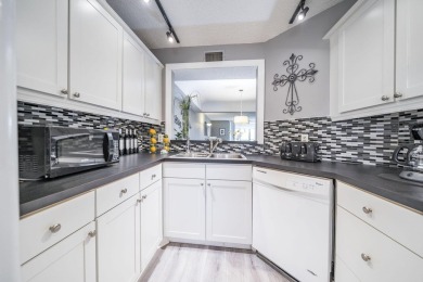 Welcome home to this updated first floor 2 BR/2 BA condo with on Boca Dunes Golf and Country Club in Florida - for sale on GolfHomes.com, golf home, golf lot