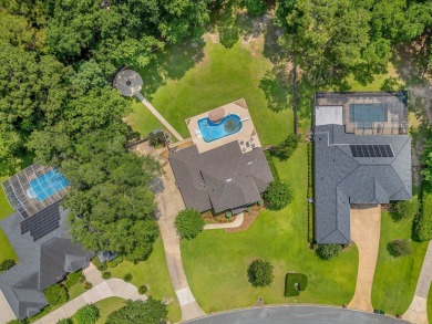 Welcome to this stunning 5-bedroom, 4.5-bathroom completely on Golden Eagle Country Club in Florida - for sale on GolfHomes.com, golf home, golf lot