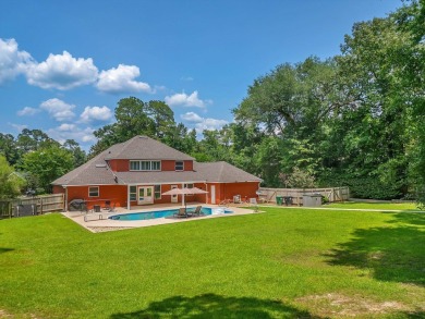 Welcome to this stunning 5-bedroom, 4.5-bathroom completely on Golden Eagle Country Club in Florida - for sale on GolfHomes.com, golf home, golf lot
