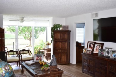Large 1st Floor corner unit.  Privateplete impact glass on Sunrise Lakes Phase III in Florida - for sale on GolfHomes.com, golf home, golf lot