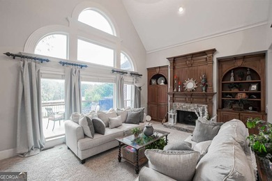 Experience refined living at 1041 Windermere Crossing an elegant on Windermere Golf Club in Georgia - for sale on GolfHomes.com, golf home, golf lot
